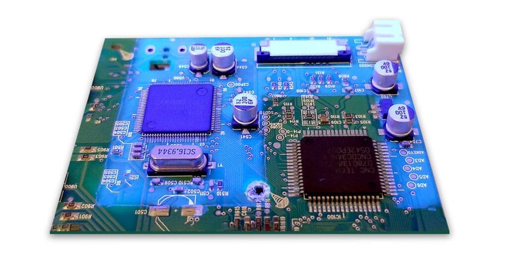 PCB under UV inspection in an SCH Technologies IB100 booth at Key-Tech